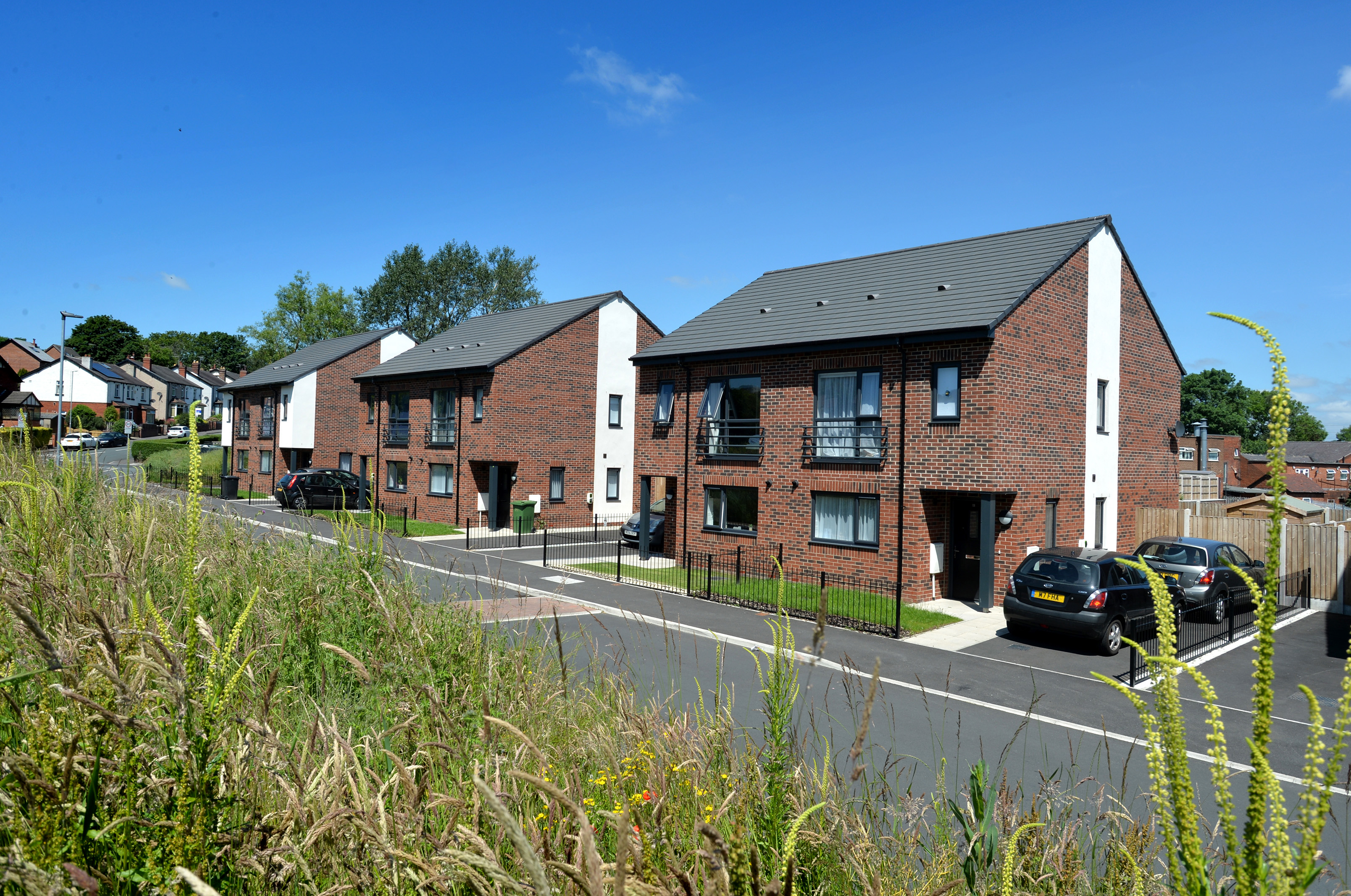A row of accessible brown brick houses