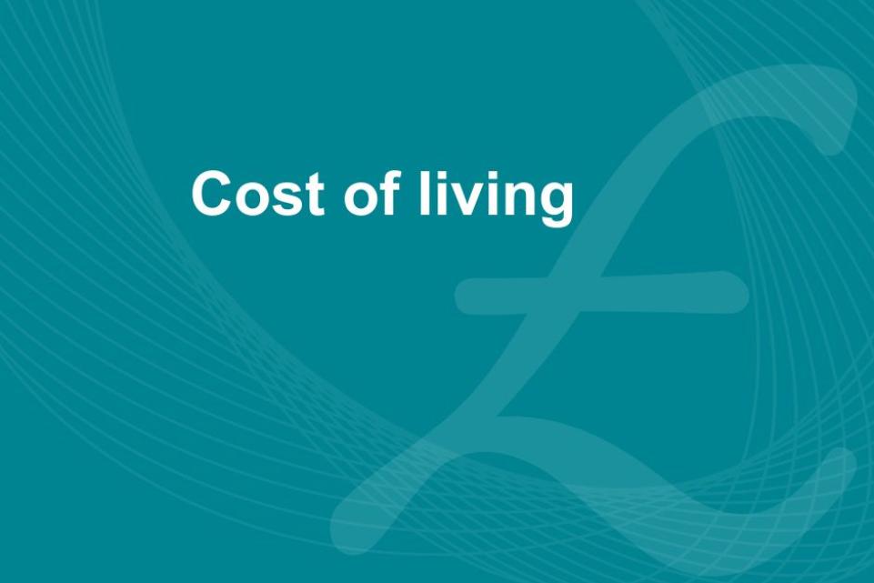 A blue background with a background image of a british pound sign and the text 'cost of living'