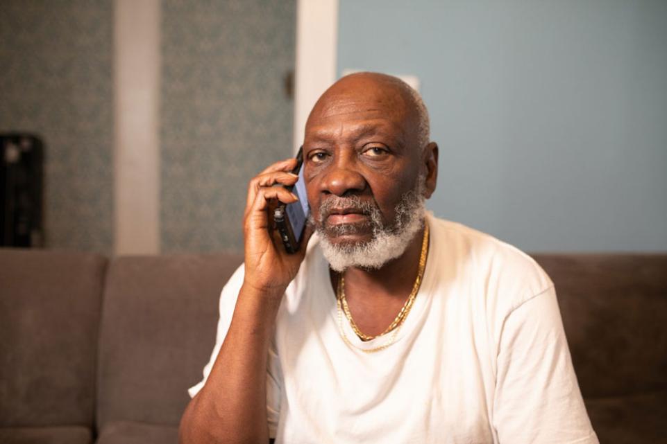 Elderly man using a mobile phone